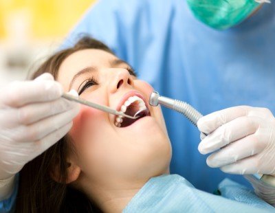 Woman receiving dental exam