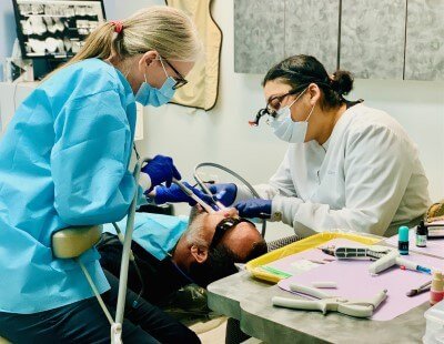 Dr. Roopam operating on her patient